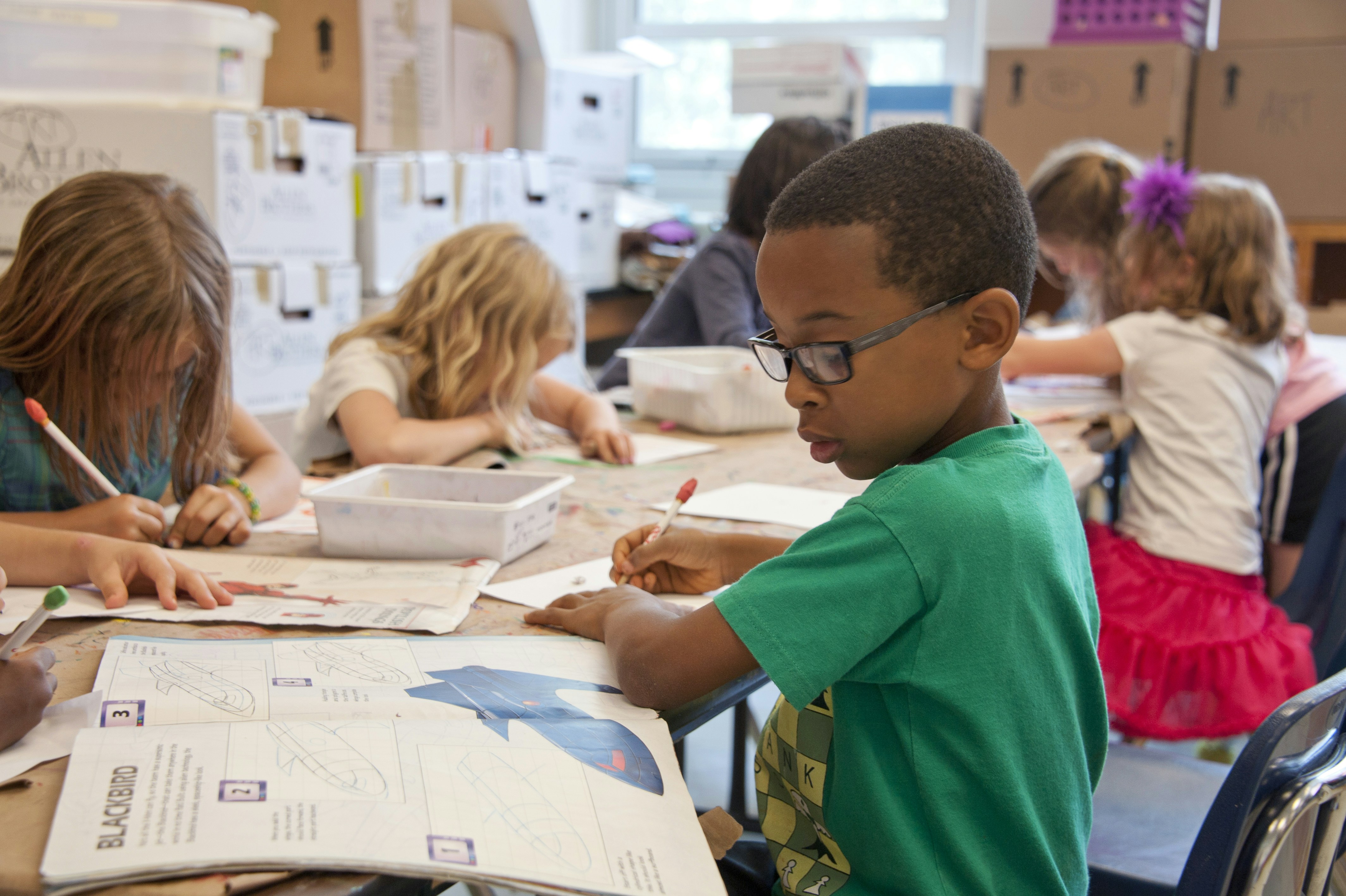 Students sitting at desks focused on learning